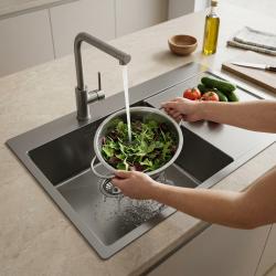 colander-with-greens-in-kitchen-sink